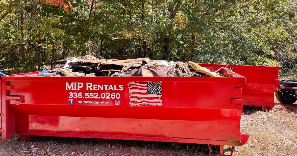 Home renovation dumpster rental in Stokes County placed in a residential driveway